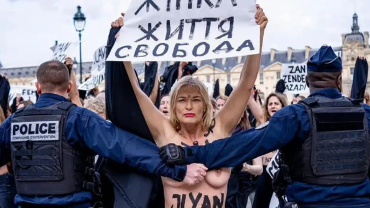 FEMEN Activists Protest Topless Outside the Louvre
