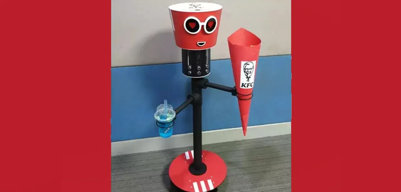 This KFC robot will carry chicken bucket, drink and walk around with you
