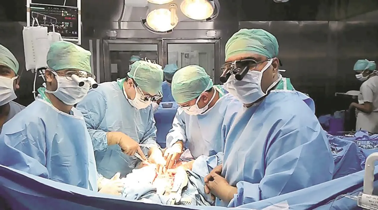 Cardiac surgeon performing heart transplant