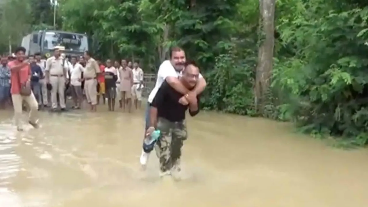 Assam BJP MLA criticised for ‘piggyback ride’ in flood waters