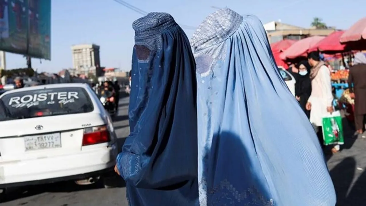 taliban announce women must cover faces and body by burqa