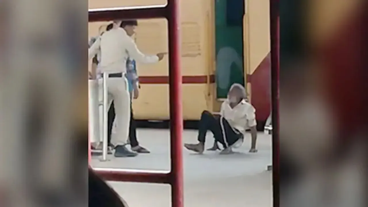 cop thrashes man, jabalpur cop thrashes man, police constable thrashes elderly man, jabalpur railway station, police officer beats elderly man at jabalpur railway station, jabalpur police officer beats old man, cop beats old man drags him at railway station