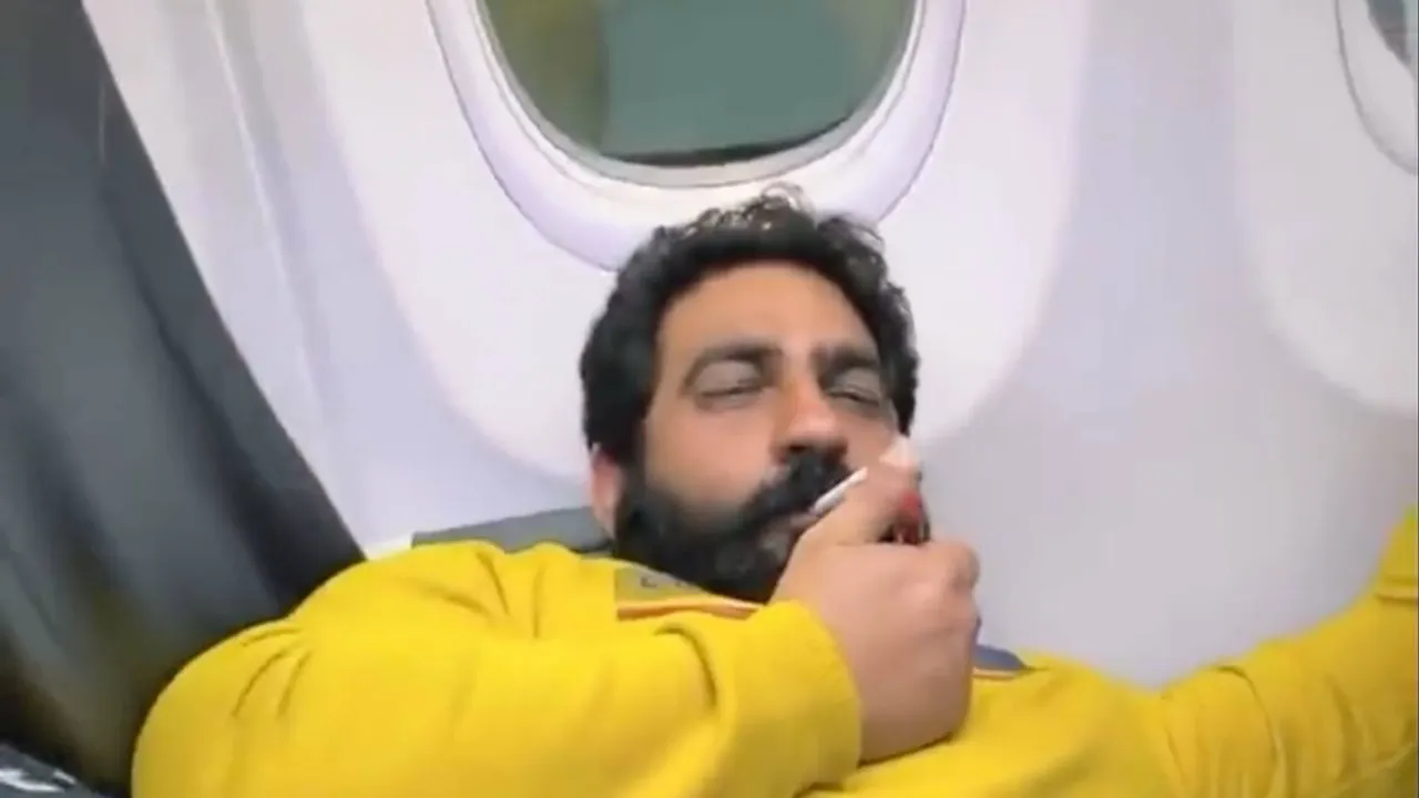 bobby kataria smoking on plane video, bobby kataria smoking on plane case, bobby kataria lookout circular, bobby kataria spicejet controversy, bobby kataria delhi police case, smoking on plane video case, social media influencer bobby kataria, delhi news, indian express