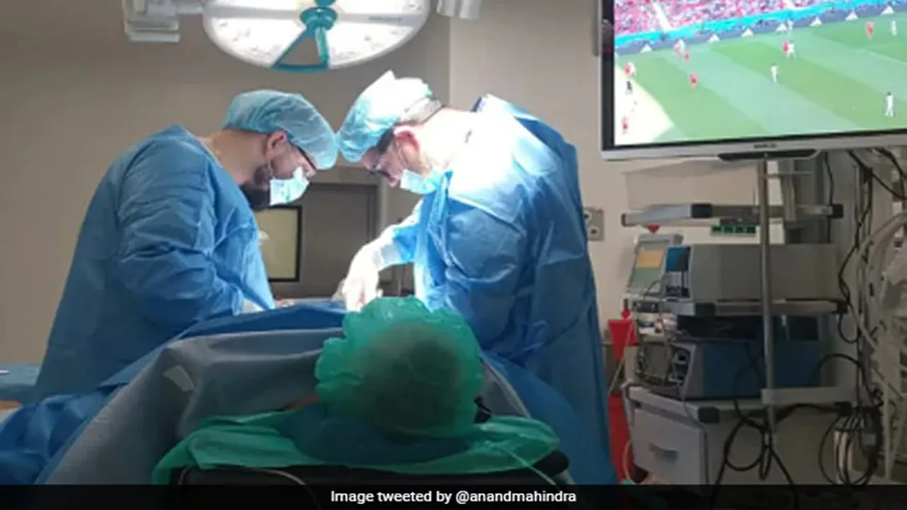FIFA World Cup match, Poland, Man watches FIFA World Cup match During Surgery, Anand Mahindra, Anand Mahindra tweet, Anand Mahindra twitter, Pic Of Man Watching FIFA World Cup During Surgery, viral pic, viral photo, Man Watching FIFA World Cup During operation, Man Watching FIFA World Cup Match During Surgery, viral news, trending news, FIFA World Cup 2022,