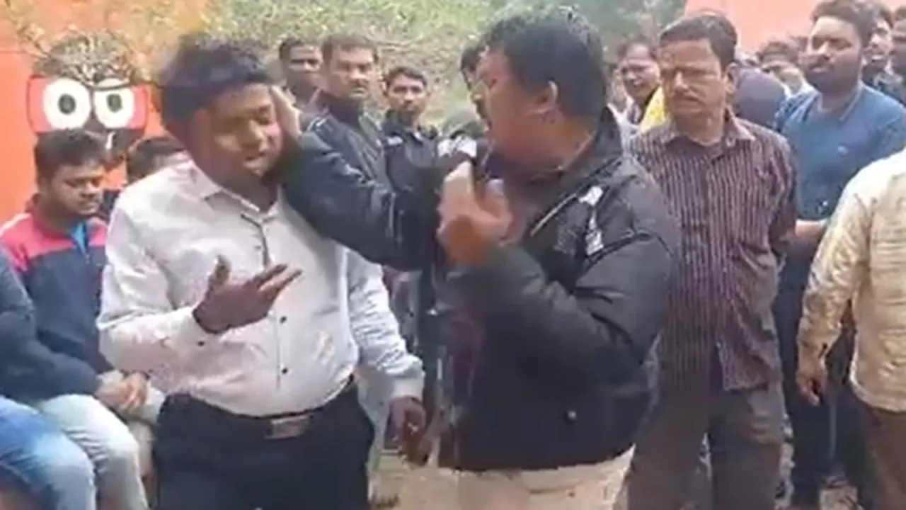 tmc worker allegedly beaten a man in presence of minister rathin ghosh