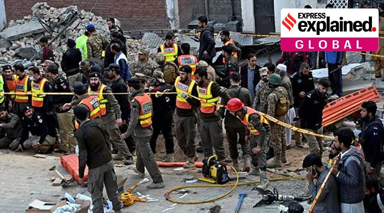 Security officials and rescue workers at the site of the suicide bombing in Peshawar, Pakistan, on Jan 30. (Photo: AP)