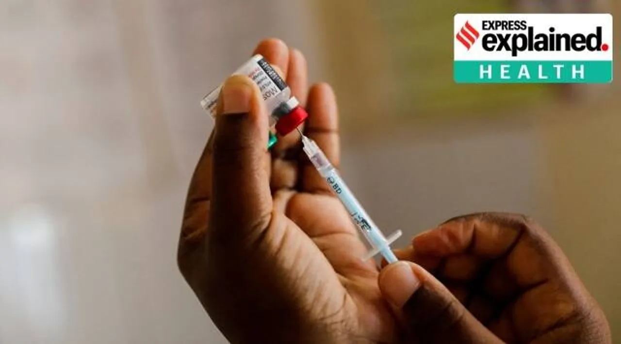A nurse fills a syringe with malaria vaccine before administering it to an infant at the Lumumba Sub-County hospital in Kisumu, Kenya, July 1, 2022.