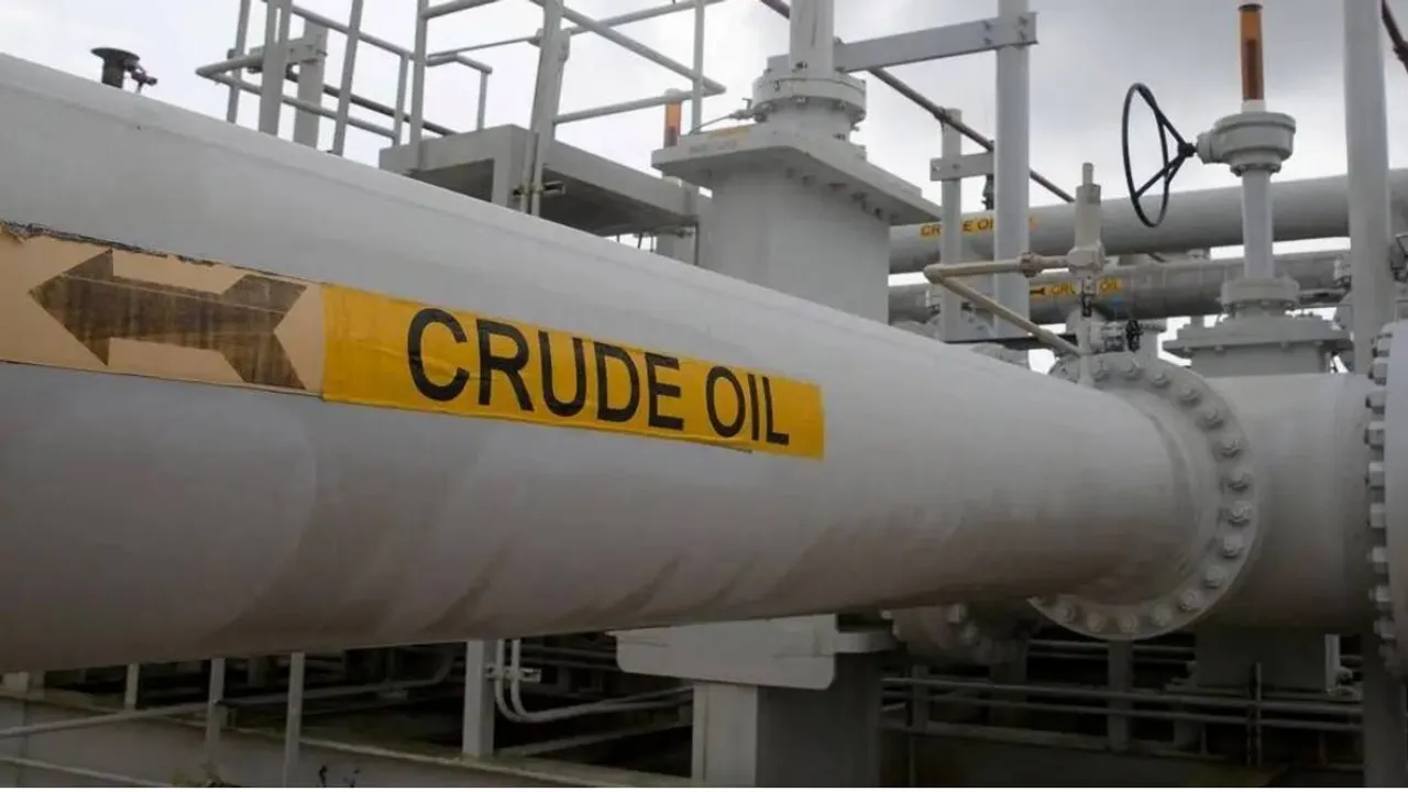 A pump jack works at sunset in an oil field in Midland, Texas, US