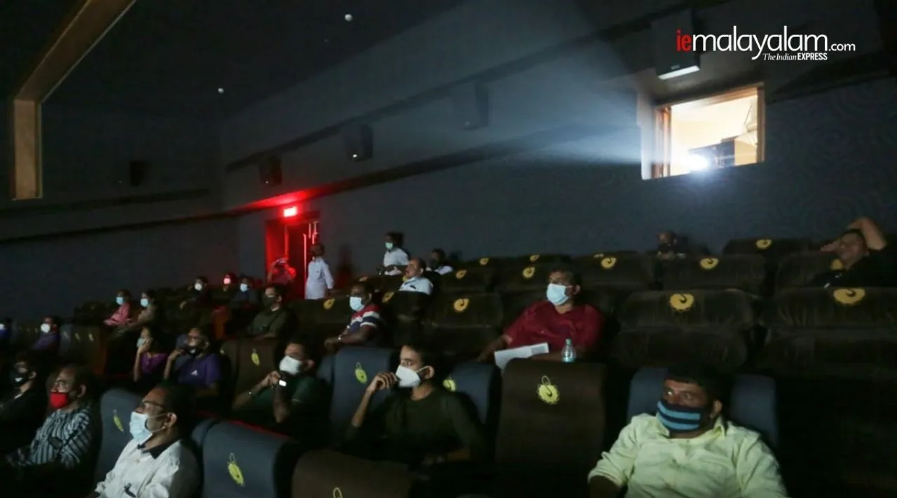 Theater,reopen, Workers clean and sanitize chairs at Balaji Movieplex Kopar Khairne