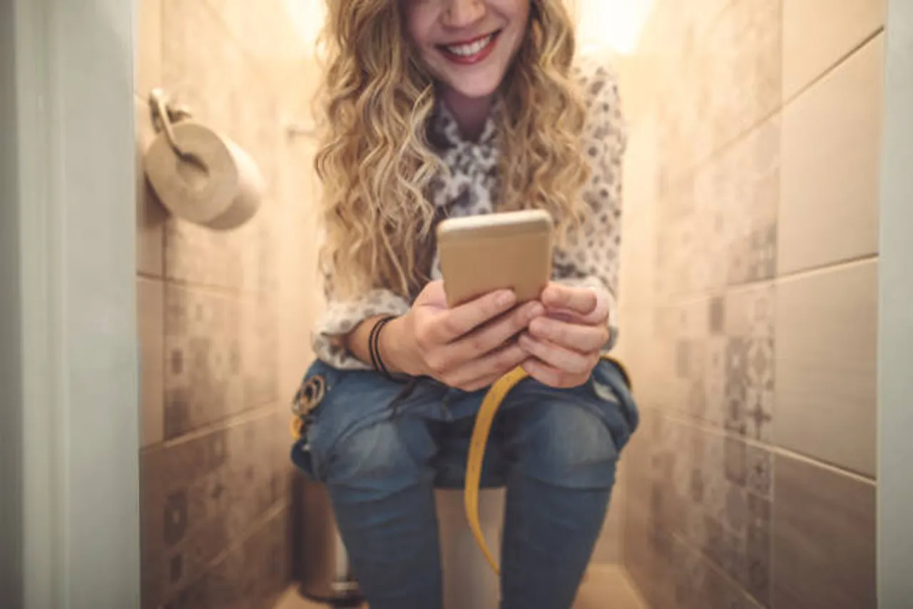 mobile in restroom