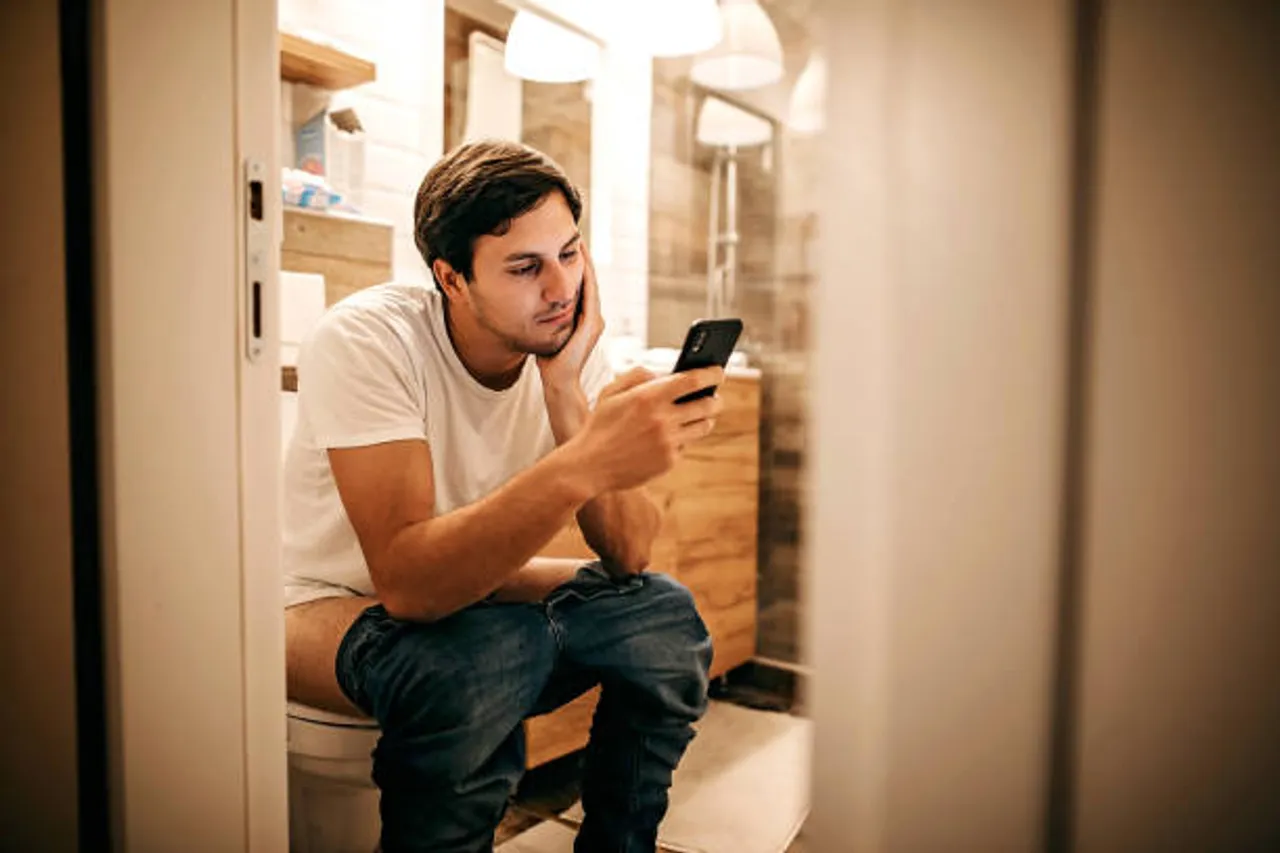 mobile in restroom