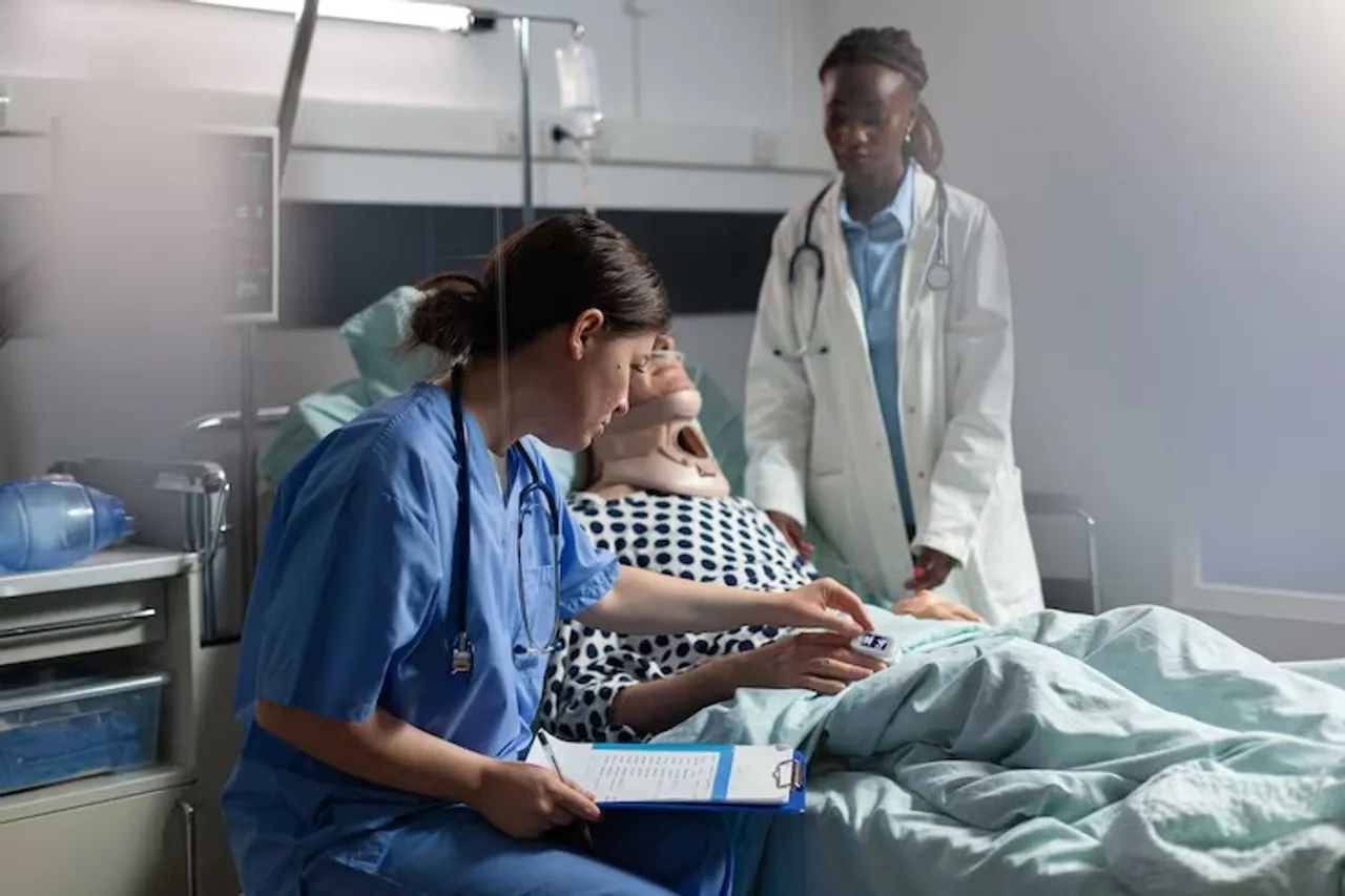 medical-assistant-checking-oximeter-attached-senior-man_482257-14024