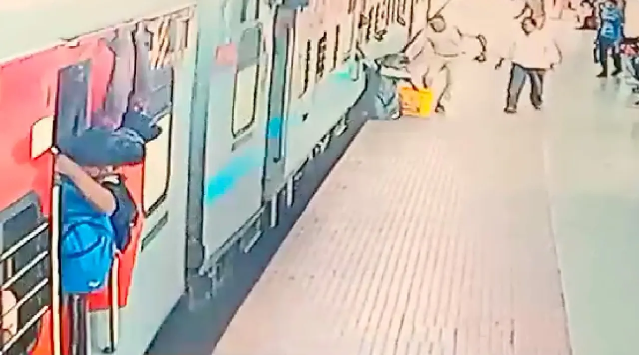 Coimbatore Railway Police Rescue woman dragged by moving train Video 