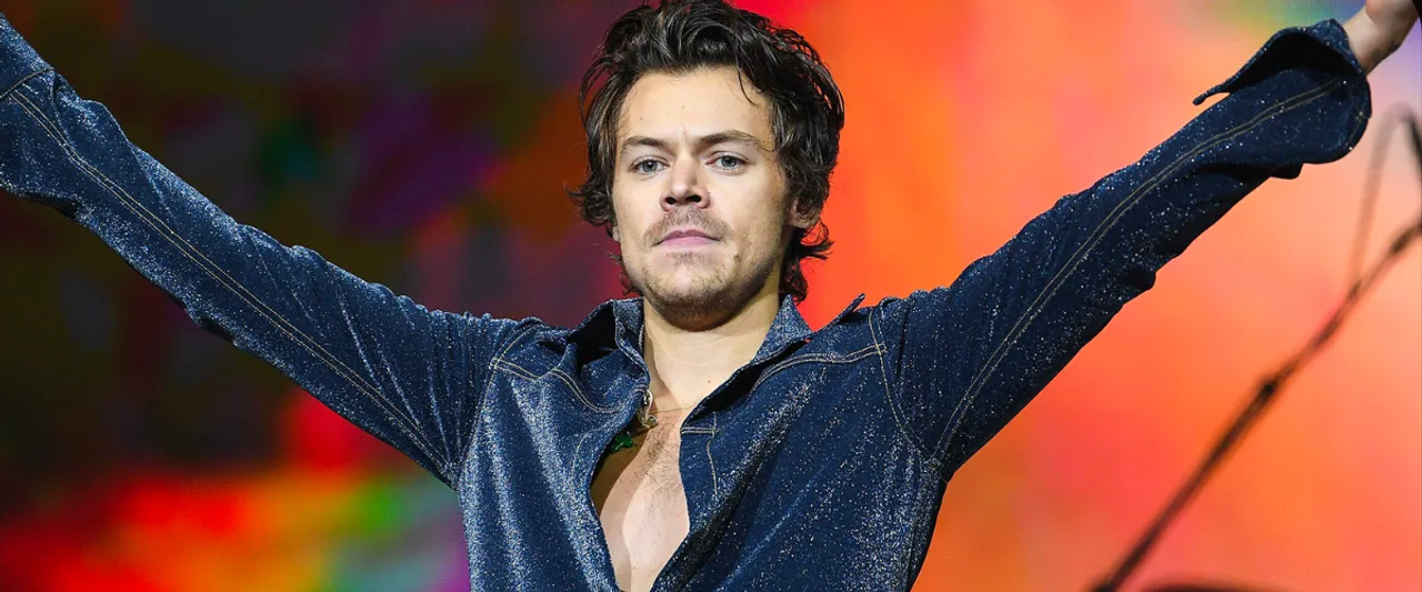 Harry Styles Partakes in The Australian Drinking Tradition, Drinks Out of His Shoe