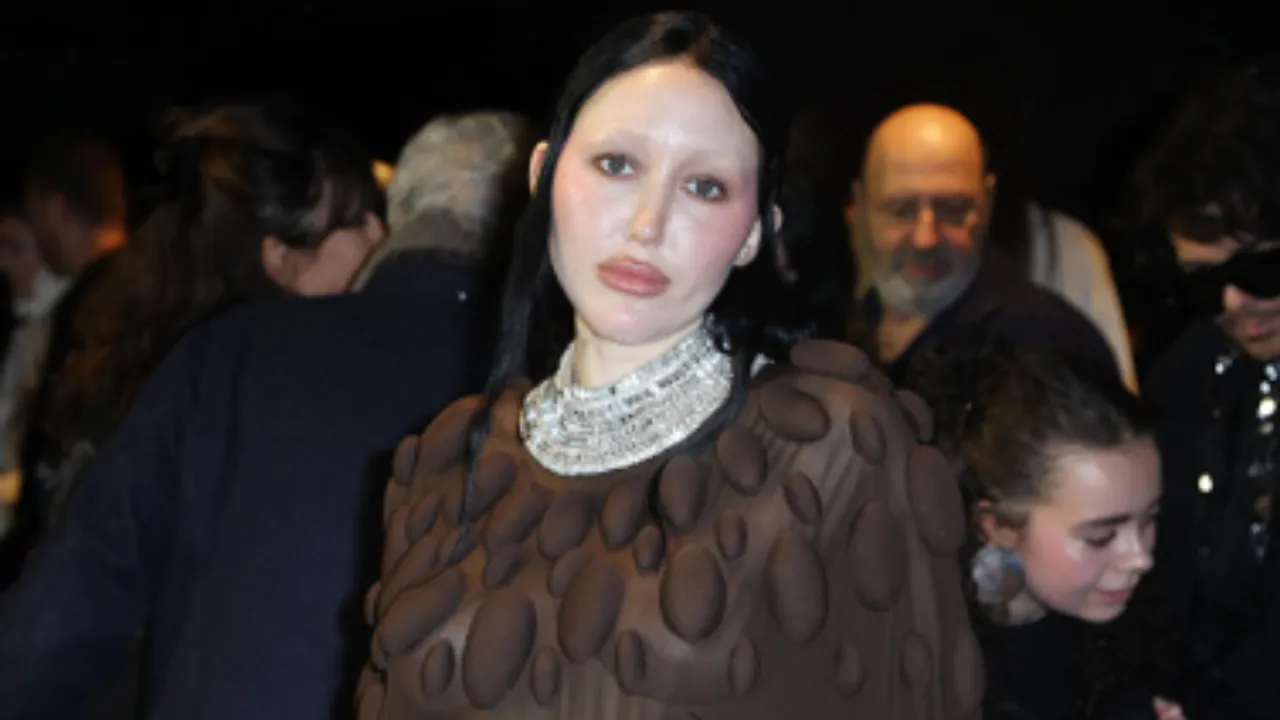 Noah Cyrus Makes a Rare Public Appearance in a Sheer Brown Cape Dress at Paris Fashion Week