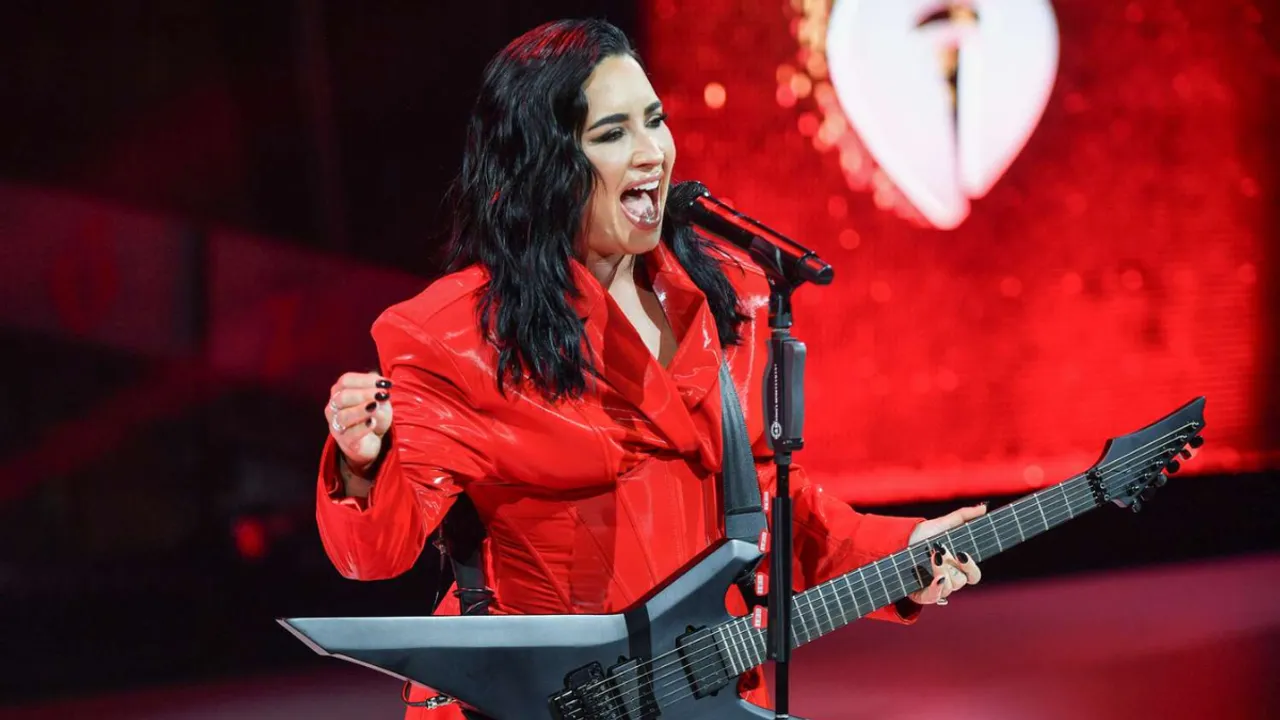 Demi Lovato Stuns in Dramatic Gown to Rocking Red Suit at AHA Red Dress Concert Performance