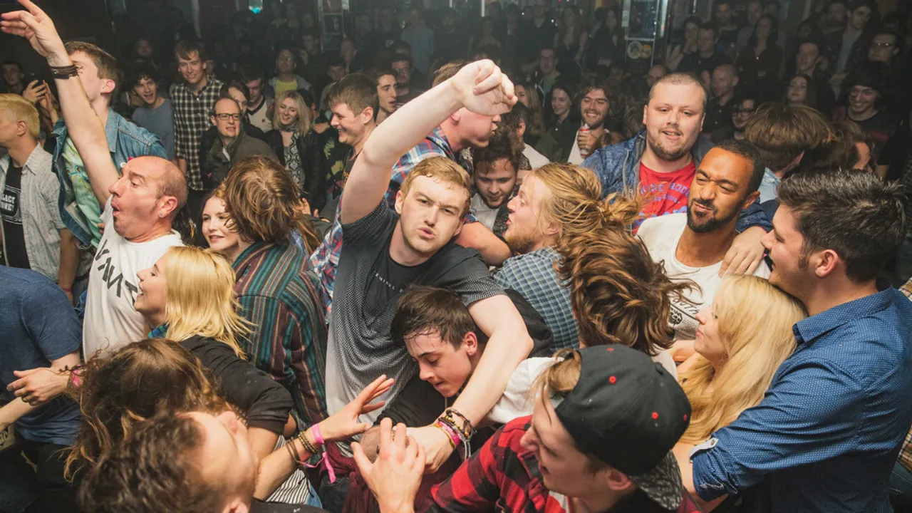 Mosh Pits : Behaviour And Dynamics of Crowd Surging