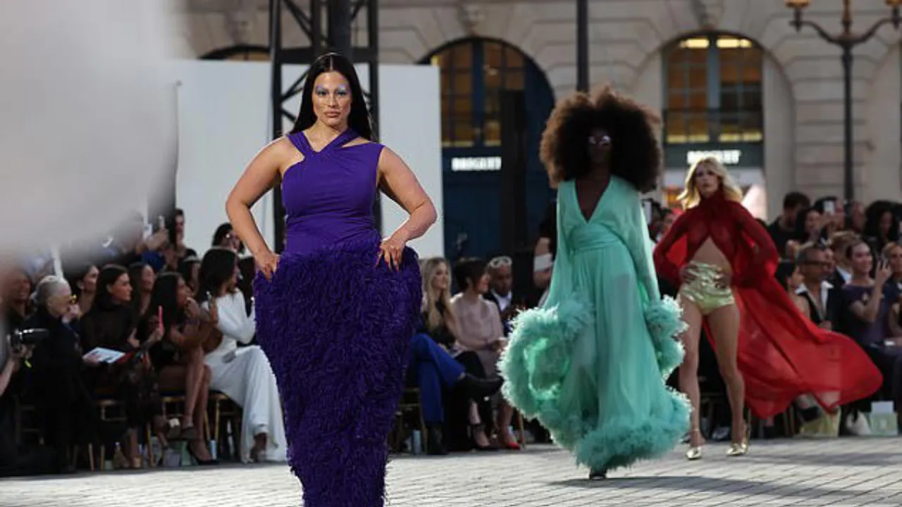 Ashley Graham Stuns in '70s-Themed Dress With Metallic Makeup at Vogue World