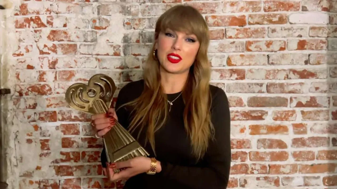 Taylor Swift Rocks Iconic Red Lip and Snake Necklace in Virtual Speech for 2025 iHeartRadio Music Awards