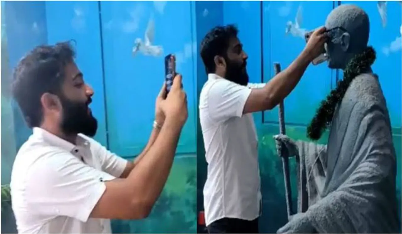 പ്രതിമയിൽ കൂളിംഗ് ഗ്ലാസ് വെച്ച് വിഡിയോ;ആലുവയിൽ മഹാത്മാ​ഗാന്ധിയെ അപമാനിച്ച് എസ്എഫ്ഐ നേതാവ്