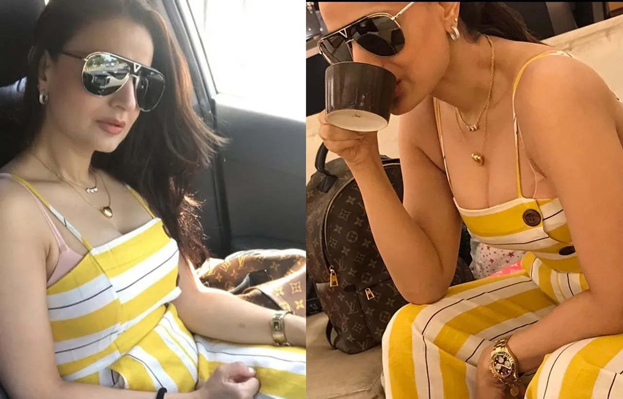 येलो कलर का जंपसूट पहने अमीषा पटेल ने शेयर की सेक्सी तस्वीरें , चाय पीते हुए दिए पोज