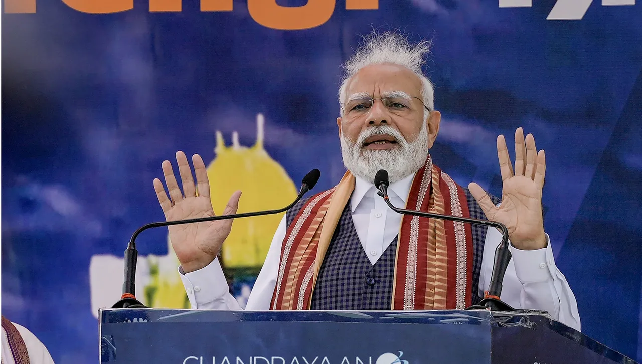 Prime Minister Narendra Modi addresses a gathering outside Palam Air Force Station upon his arrival in New Delhi