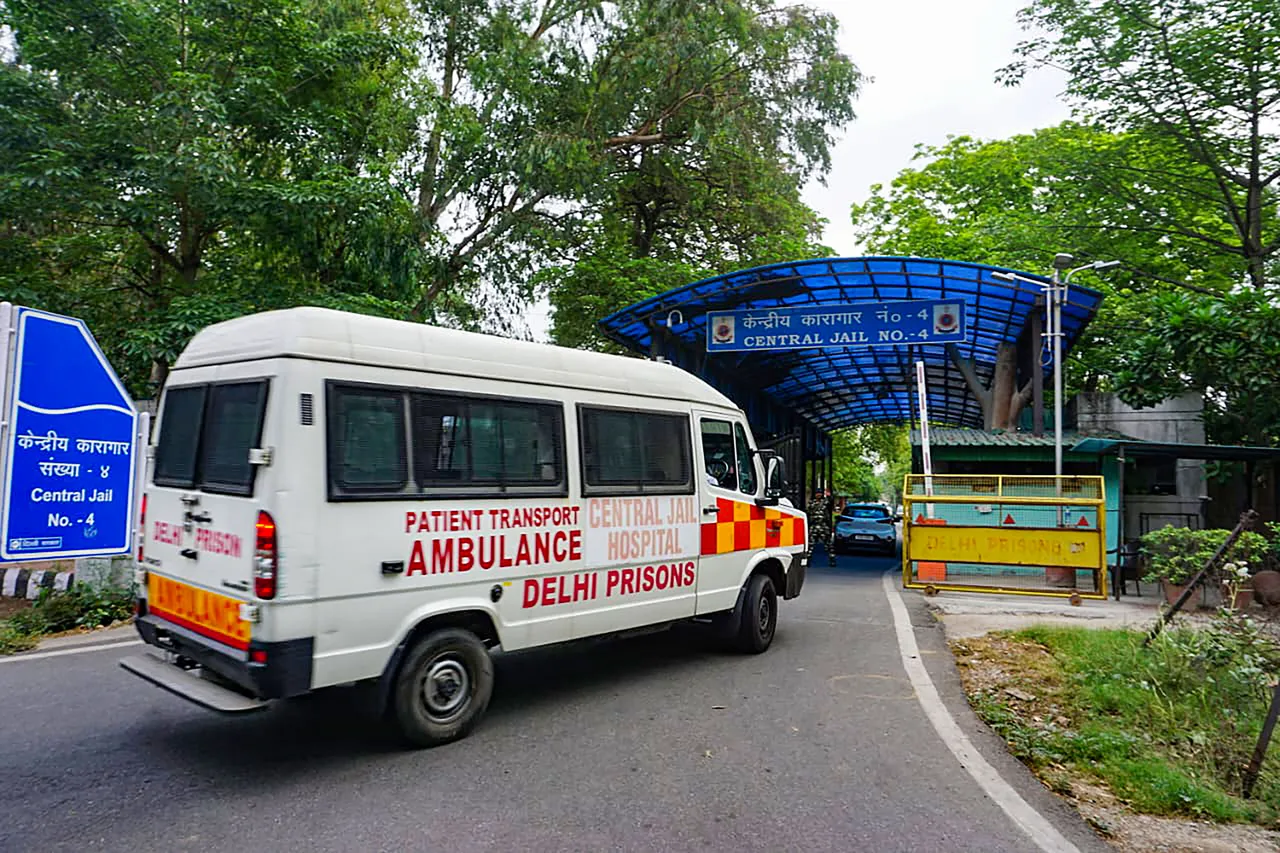 An ambulance arrives at Tihar Jail, in New Delhi