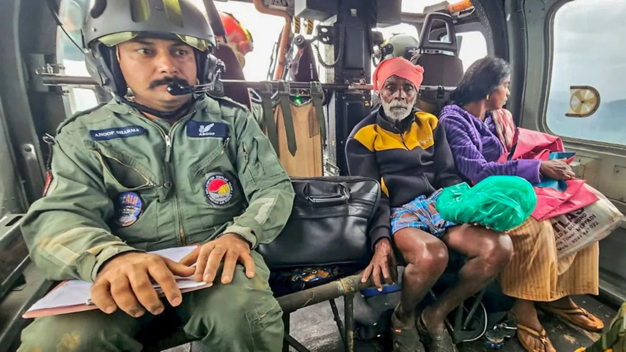 Indian Air Force personnel conduct search and rescue operation following landslides triggered by heavy rain in the hilly areas of Wayanad district on Tuesday.