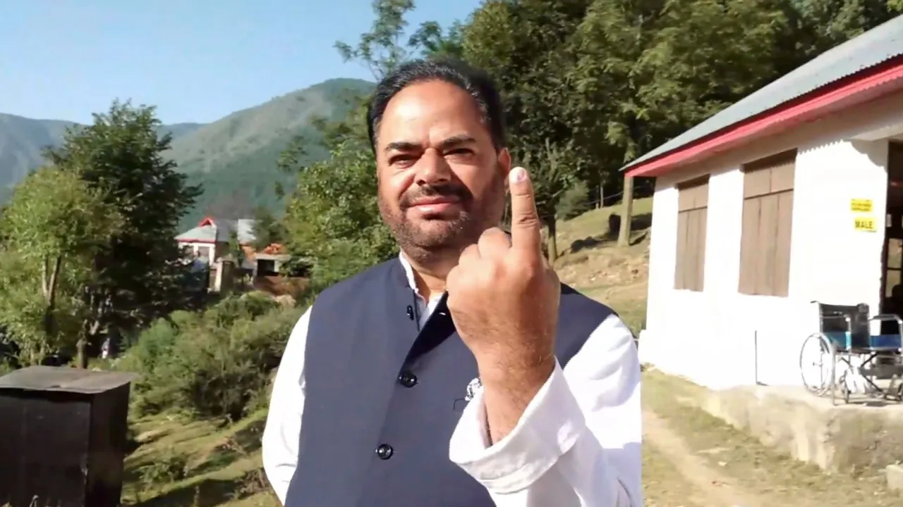 Congress candidate from Banihal constituency Vikar Rasool Wani shows his finger marked with indelible ink after casting his vote, in Ramban district, Wednesday, Sept. 18, 2024.