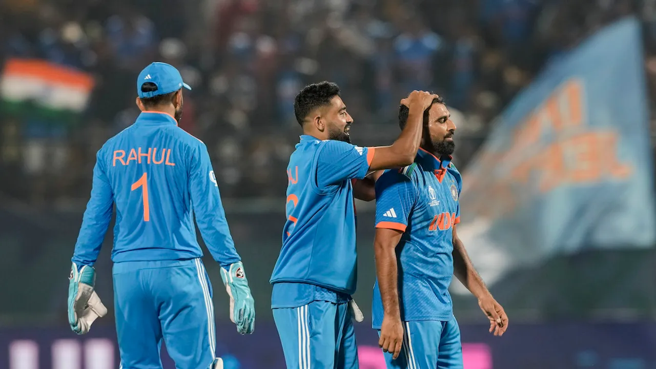 Indian bowler Mohammed Shami with teammates celebrates the wicket of New Zealand's Daryl Mitchell during the ICC Men's World Cup ODI cricket match between India and New Zealand at HPCA Stadium, Dharamshala, Sunday, Oct. 22, 2023.