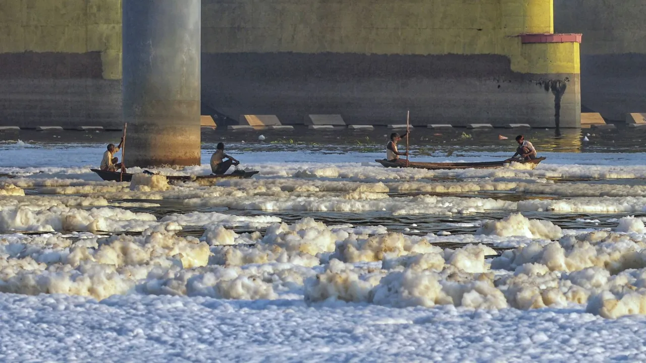 Toxic foam floats on the surface of the polluted Yamuna river, at Kalindi Kunj, in New Delhi, Friday, Oct. 18, 2024.