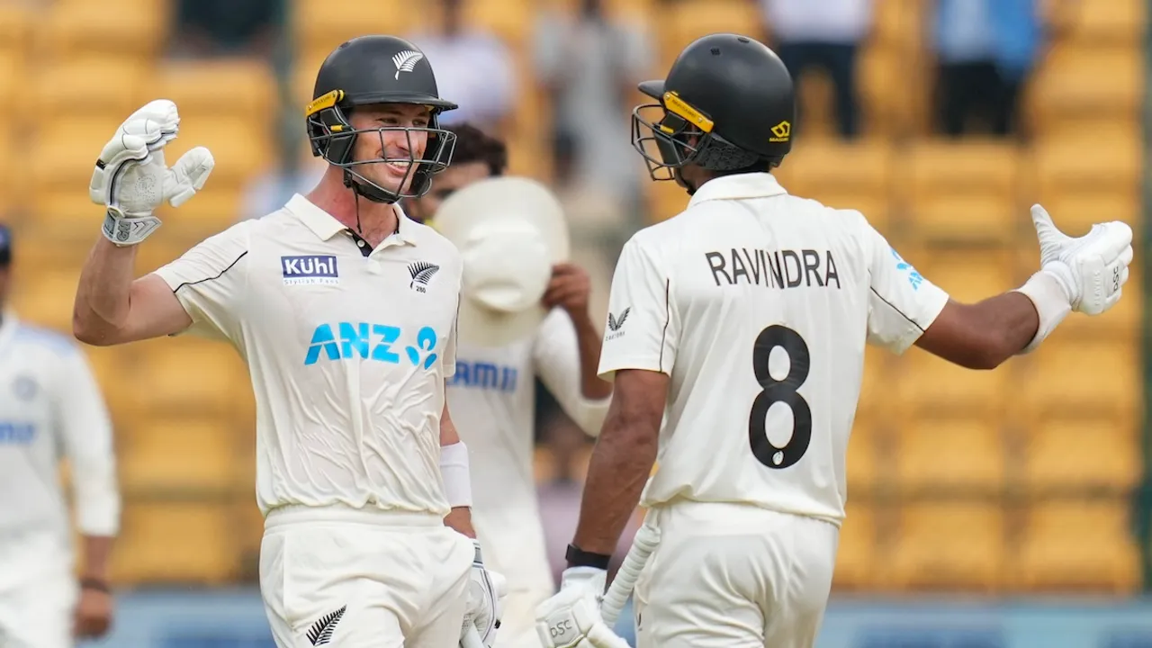 New Zealand's Rachin Ravindra and Will Young celebrate after winning the first test cricket match between India and New Zealand at M Chinnaswamy Stadium, in Bengaluru, Sunday, Oct 20, 2024.