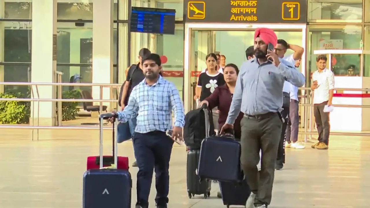 Passengers of the IndiGo flight that received a bomb threat come out of the Chandigarh airport, Saturday, Oct. 19, 2024.