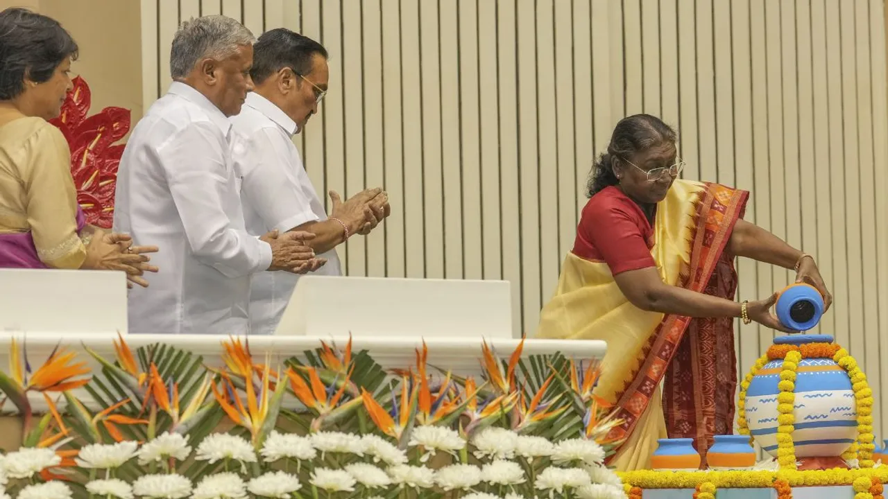 President Droupadi Murmu pours water into a pot during the 5th National Water Awards ceremony, in New Delhi, Tuesday, Oct. 22, 2024
