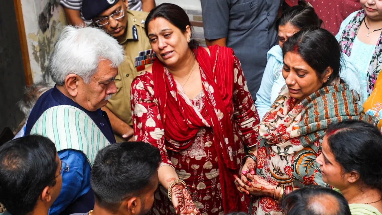 Jammu and Kashmir Lieutenant Governor Manoj Sinha meets the family members of Shashi Bhushan Abrol, who was killed in a terrorist attack in J&K's Ganderbal on Sunday, in Jammu, Monday, Oct. 21, 2024.