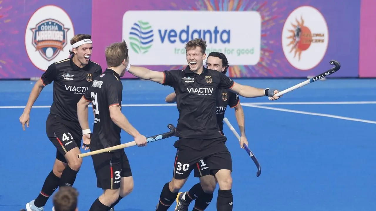 Henrik Mertgens of Germany (second right) celebrates a goal during the bilateral hockey series against India