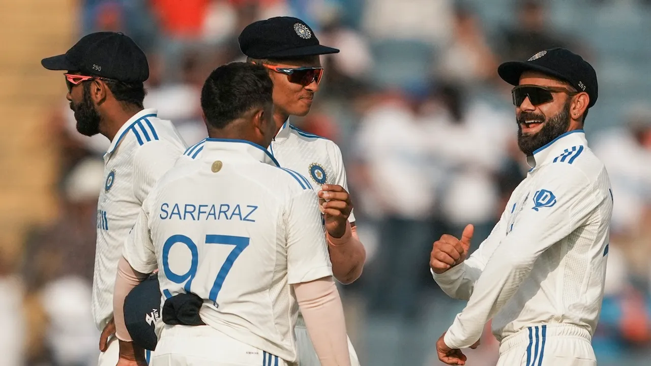 Virat Kohli, Yashasvi Jaiswal and Sarfaraz Khan celebrate the wicket of New Zealand's captain Tom Latham during the second day of the second test cricket match between India and New Zealand, at the Maharashtra Cricket Association Stadium, in Pune, Friday, Oct. 25, 2024.