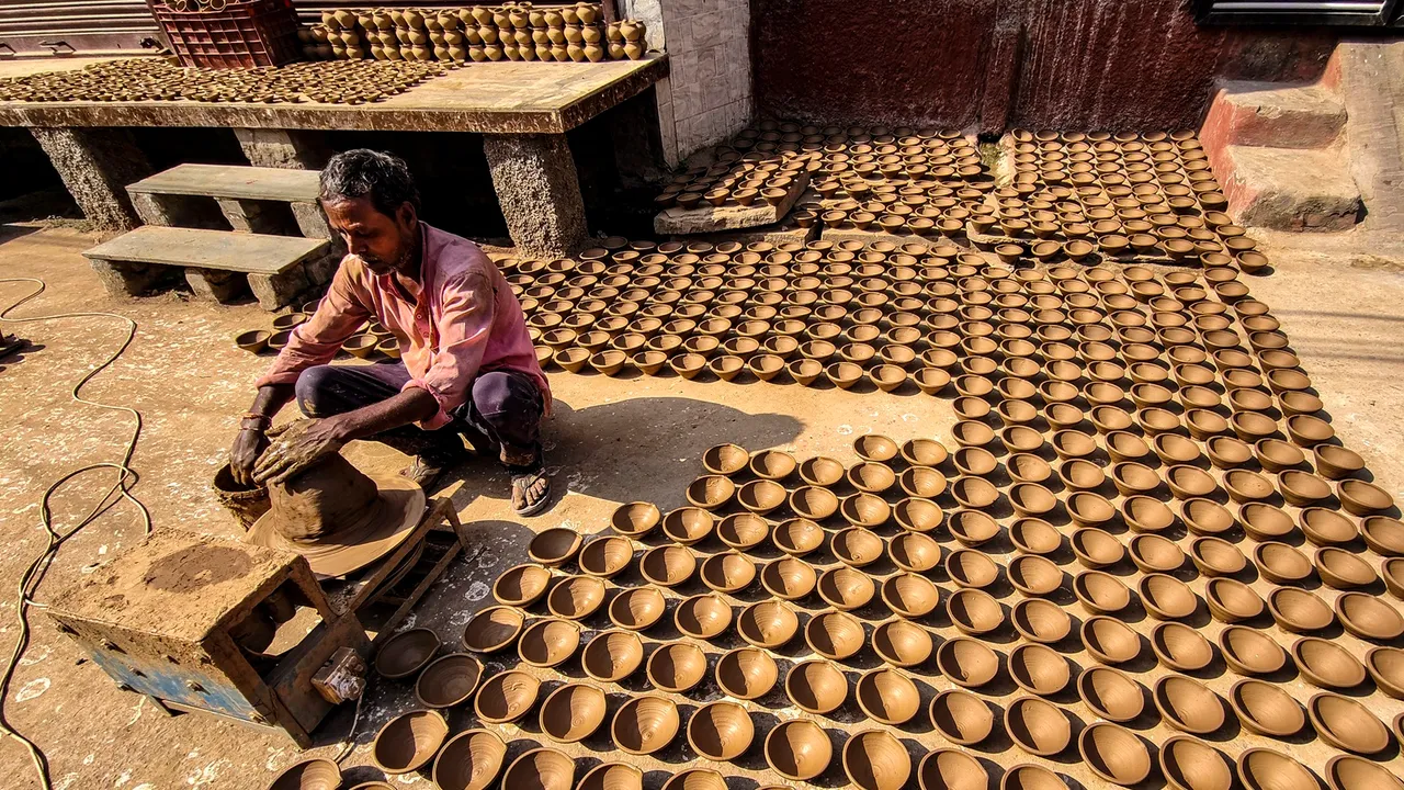 A potter makes 'diyas' ahead of Diwali festival, in Ajmer, Friday, Oct 25, 2024.