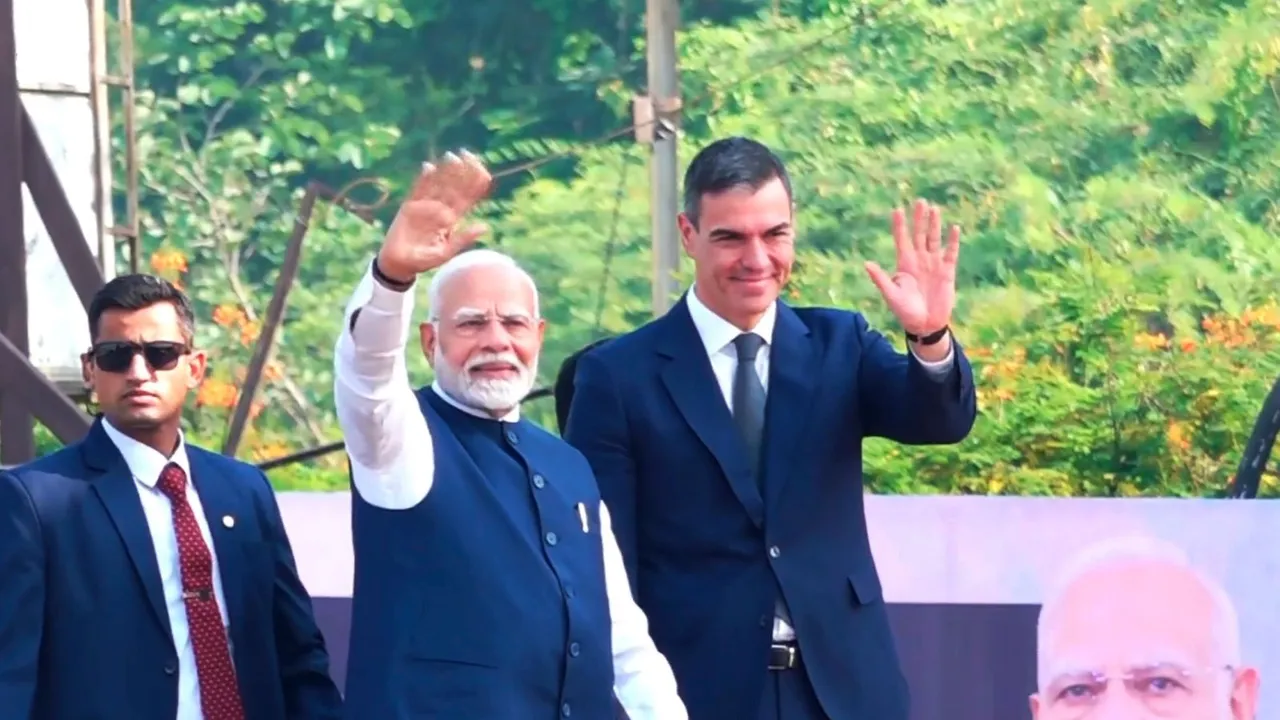 Prime Minister Narendra Modi and Spanish Prime Minister Pedro Sanchez wave during a roadshow in Vadodara, Gujarat, Monday, Oct. 28, 2024.