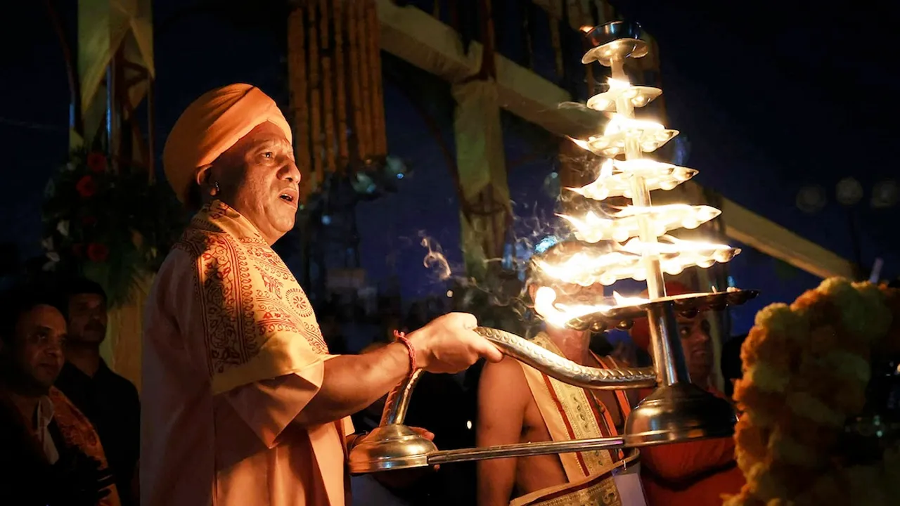 Yogi Adityanath performs aarti on the banks of the Saryu river during Deepotsav 2024 celebration on the eve of the Diwali festival, in Ayodhya.