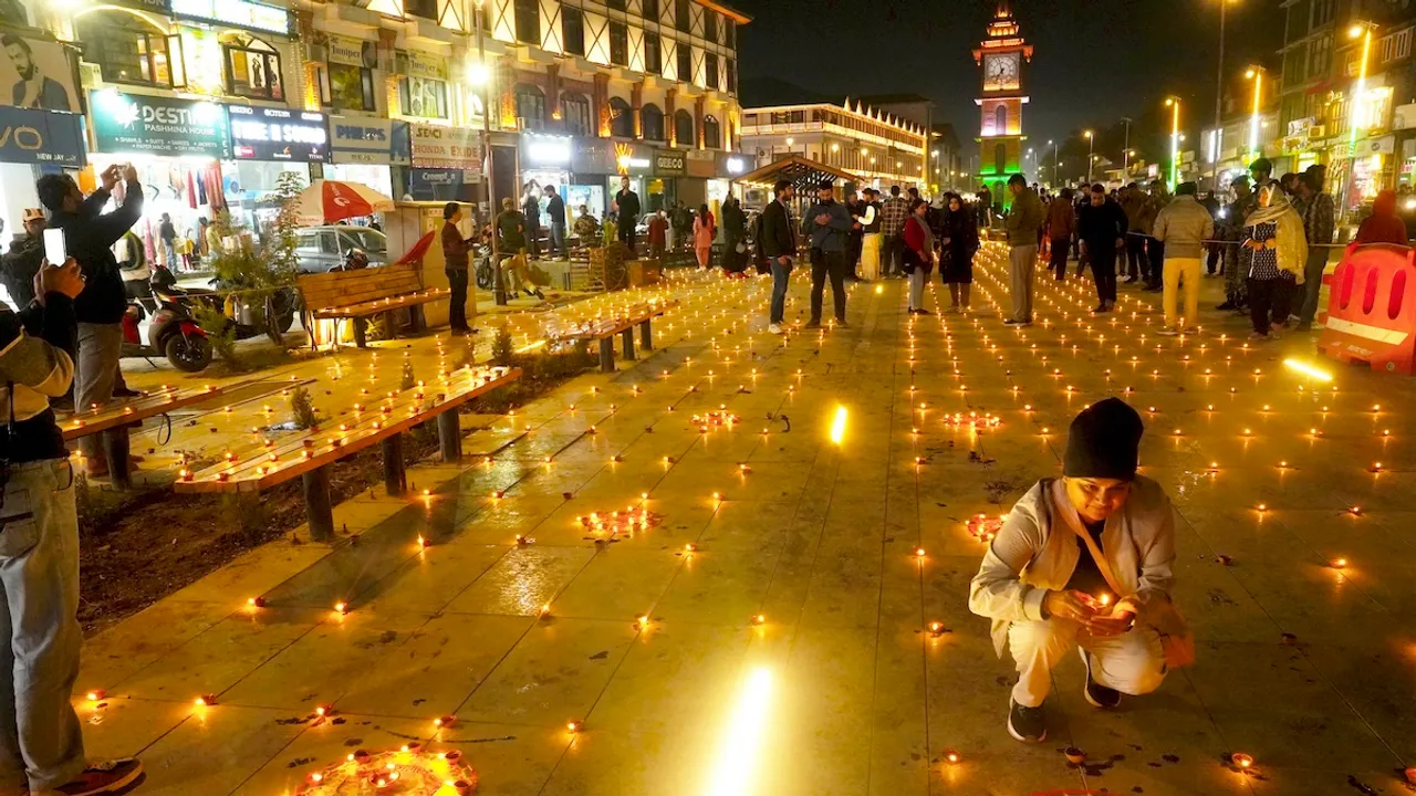 People light 'diyas' during the Diwali festival celebration, at Lal Chowk in Srinagar, Thursday, Oct 31, 2024.