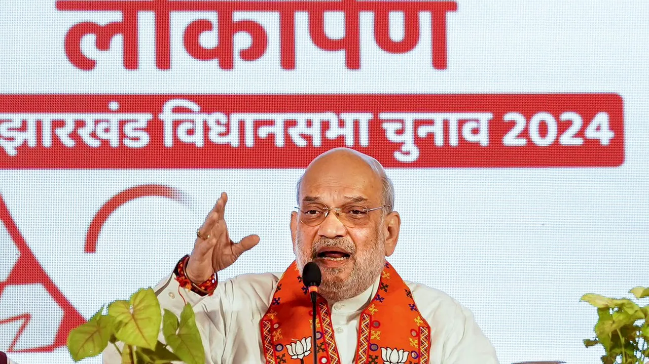 Union Minister and senior BJP leader Amit Shah speaks at the release of the party's Sankalp Patra (election manifesto) for the upcoming Assembly elections, in Ranchi, Sunday, Nov. 3, 2024