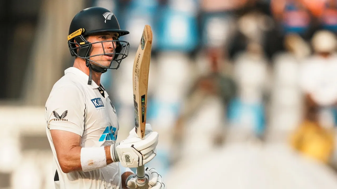New Zealand's Will Young celebrates his half century on the second day of the third test cricket match between India and New Zealand, at the Wankhede Stadium, in Mumbai, Saturday, Nov. 2, 2024.