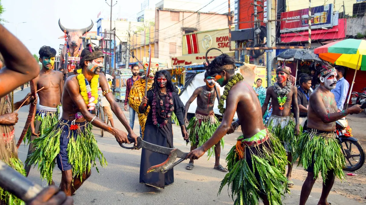 A traditional cultural troupe performs during a procession for immersion of an idol of Goddess Kali after 'Kali Puja' festival, in Cuttack, Odisha, Sunday, Nov. 3, 2024.