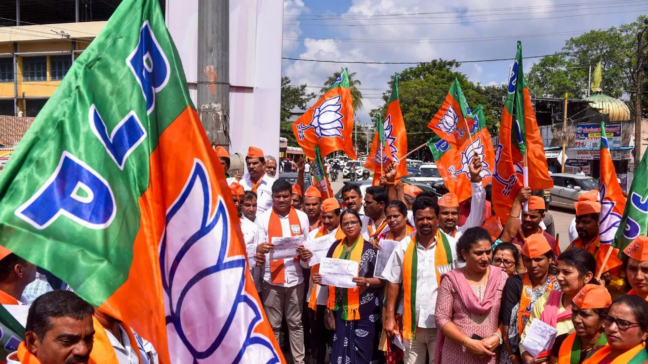 BJP workers stage a protest following allegations by farmers in several parts of Karnataka that their lands were marked as Waqf Board properties, in Chikkamagaluru district, Karnataka, Monday, Nov. 4, 2024.