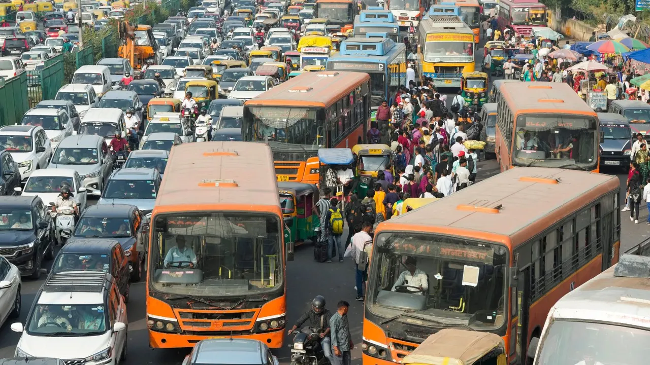 Vehicles stuck in a traffic jam at Anand Vihar, in New Delhi