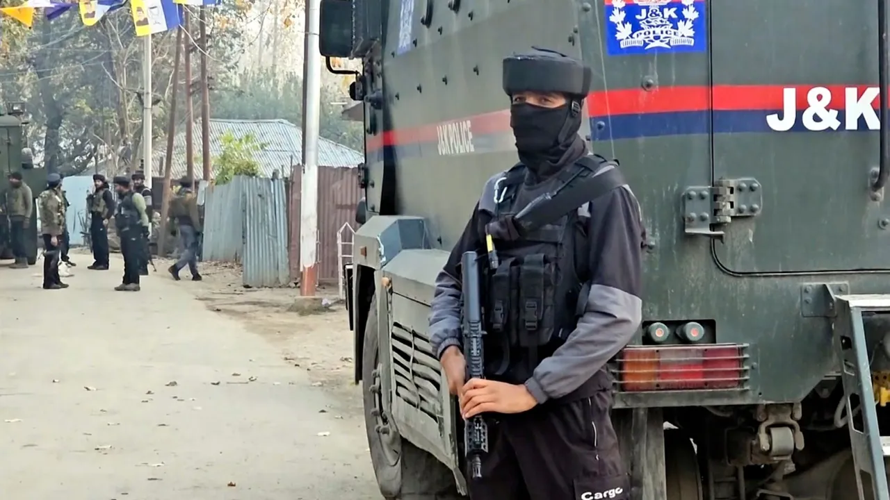 Security personnel stand guard during an encounter with terrorists at Sopore, in Baramulla district, Friday, Nov. 8, 2024.