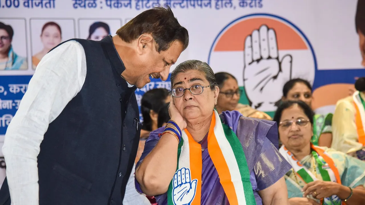 Congress candidate Prithviraj Chavan with his wife Satvasila Chavan during a women's rally for Assembly polls, in Karad, Maharashtra, Sunday, Nov. 10, 2024.