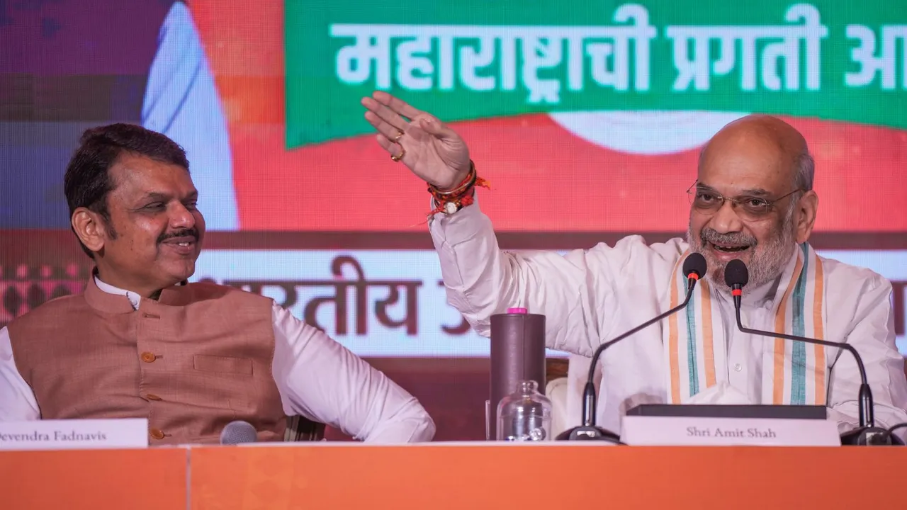 Union Minister Amit Shah and Maharashtra Deputy Chief Minister Devendra Fadnavis during the release of BJP's manifesto for Maharashtra Assembly elections, in Mumbai, Sunday, Nov. 10, 2024.