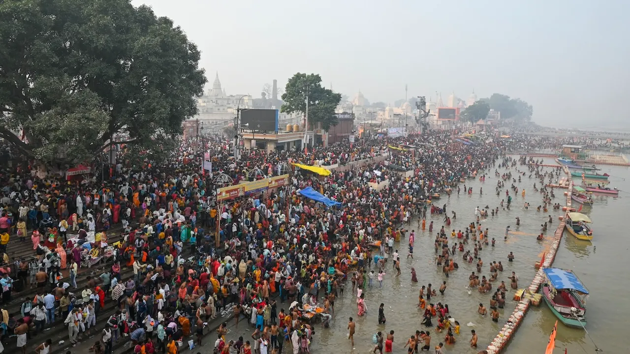 Devotees take a holy dip in the Saryu river, in Ayodhya, Sunday, Nov. 10, 2024.